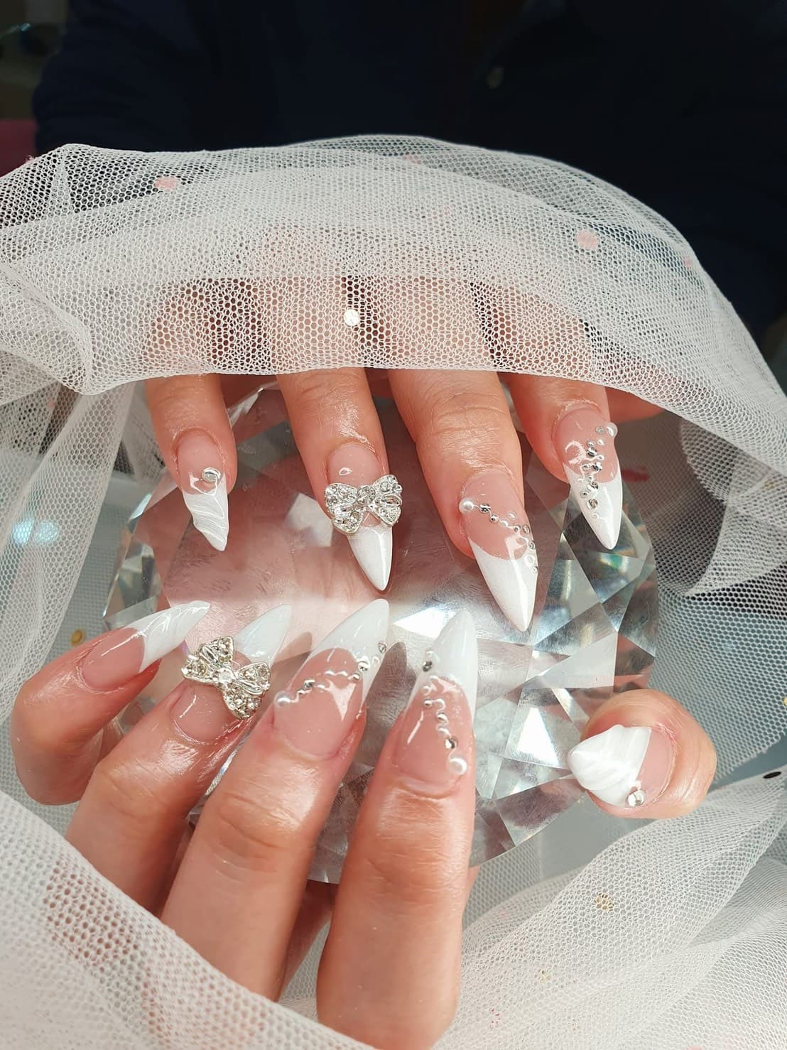 Close-up of hand-painted nail art at Diamond Nails Studio